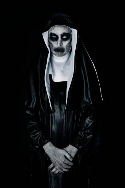 portrait of a frightening evil nun - bad habit imagens e fotografias de stock