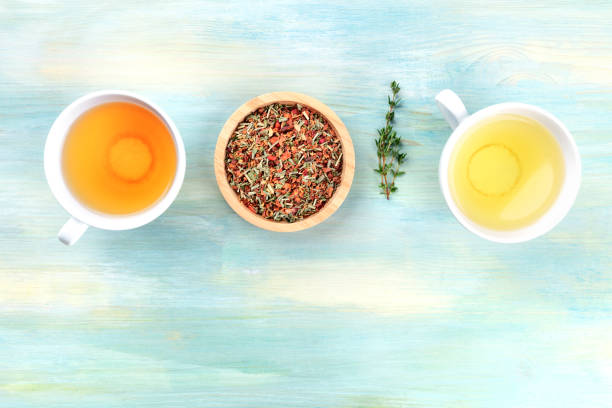 istock An overhead photo of tea on a teal background with copyspace 1053022086