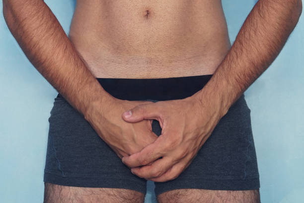 handsome man is using his hands closing his penis. attractive man gets painful of mind, he can t has sex. he get erectile dysfunction. he feels unhappy and depressed. he feels shy and lost confident. - roupa de baixo imagens e fotografias de stock