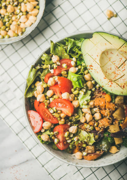 istock Vegan bowl with avocado, grains, beans and vegetables 1053030008