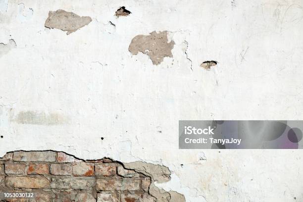 Damaged Brick Wall Cracked Plaster Stock Photo - Download Image Now - Eroded, Brick, Wall - Building Feature