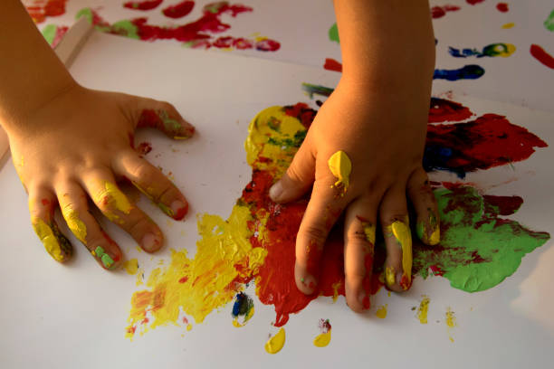 istock Children's hands in colors 1053033508