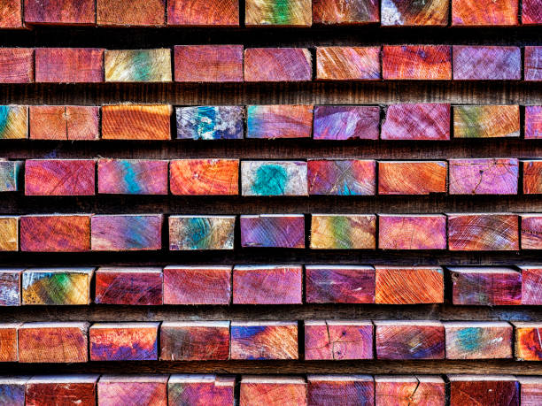 istock Multi-colored marked timber length ends in a wood factory. 1053034030