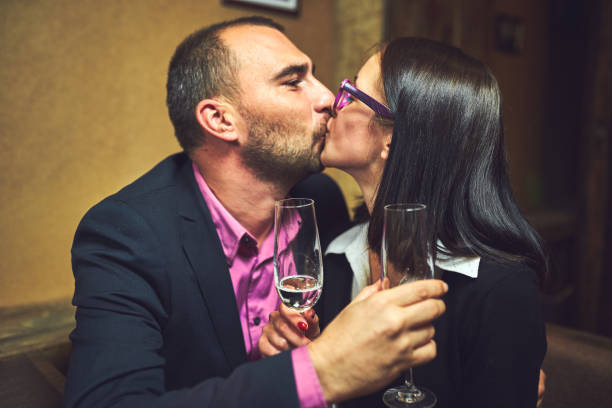 istock Emotional bartender spills champagne behind the bar 1053039102