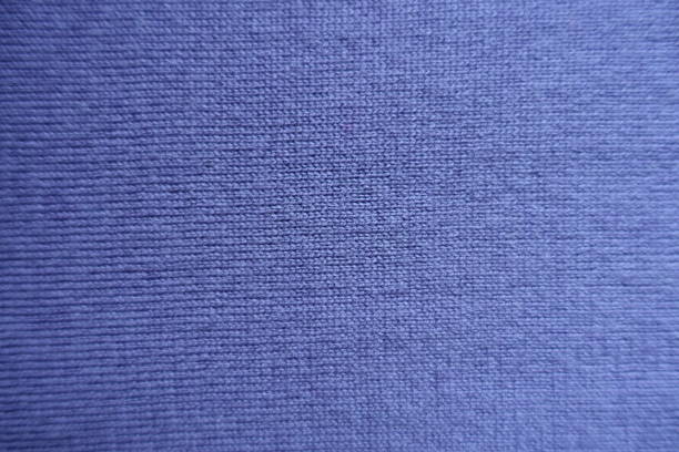 istock Texture of plain blue knitted fabric from above 1053041102