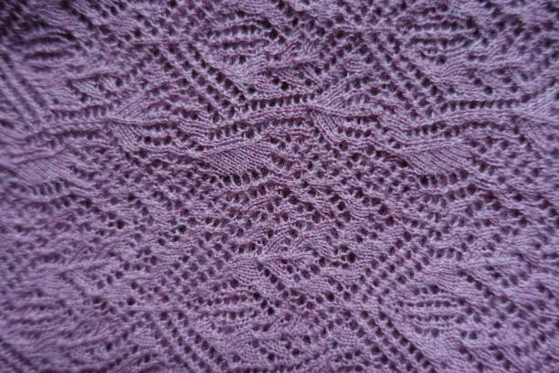 istock Thin pink handmade knitted lace from above 1053041422