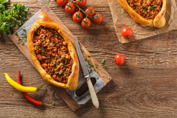 istock Turkish pide pizza with meat and cheese. 1053045880