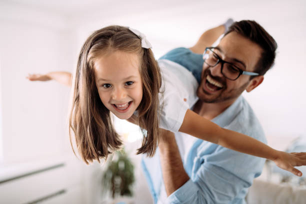 istock Happy family having fun time at home 1053046622