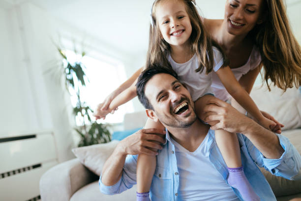 istock Happy family having fun time at home 1053047716