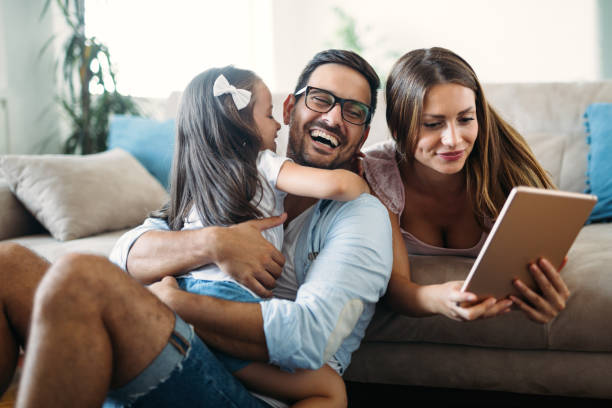 istock Happy family having fun time at home 1053047802