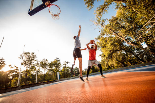 istock Friends playing basketball 1053048132
