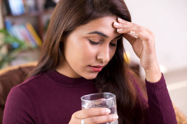 istock Woman suffering from headache 1053050056