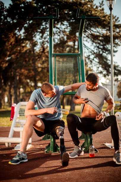 istock Friends resting after exercise in outdoor gym 1053050100