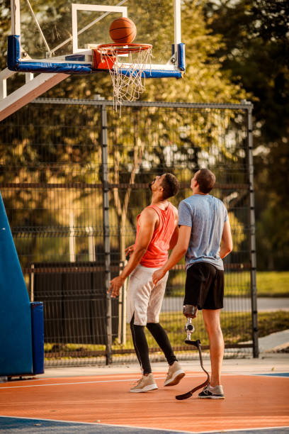 istock Friends playing basketball 1053050178