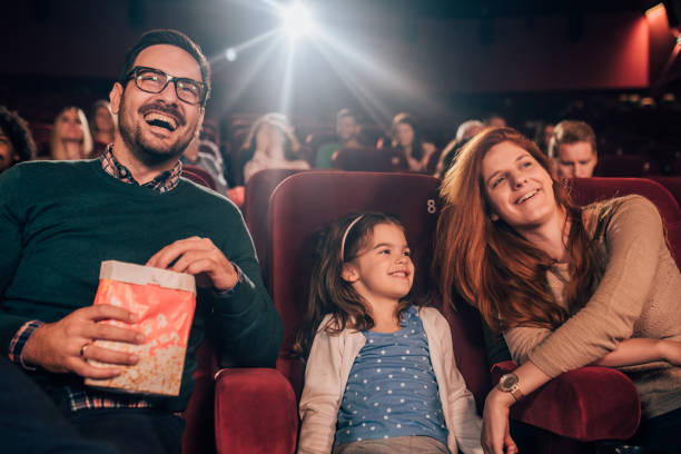 istock Young couple in cinema with a daughter 1053050576