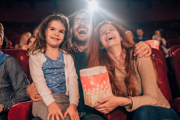 istock Family hugging at cinema 1053050810