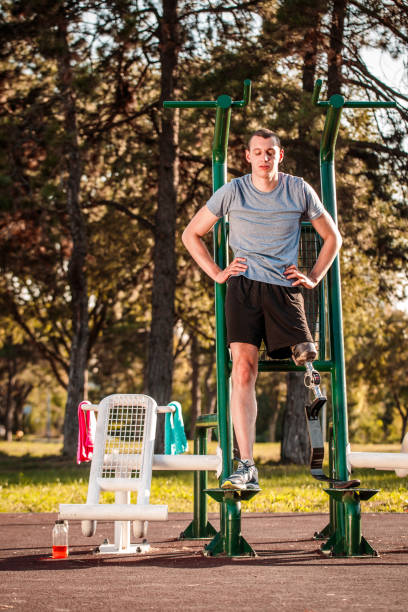 istock Disabled man exercising in outdoor gym 1053050990