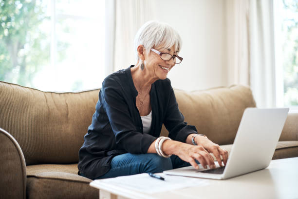 istock Accessing her investments online 1053057408