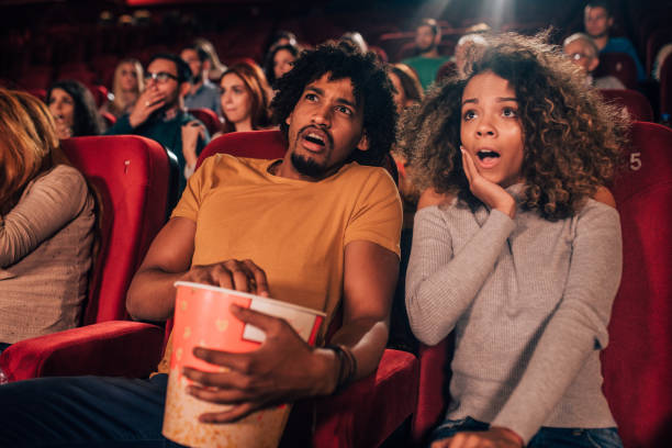 istock Afraid couple at cinema together 1053057780