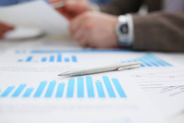istock Group of people deliberate on problem with infographics 1053059968