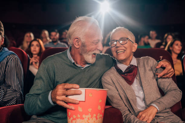 istock Smiling couple hugging at cinema 1053060600