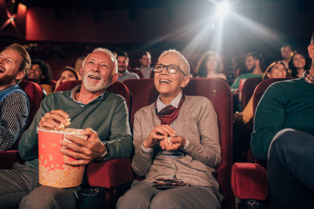 istock Couple eating popcorn at cinema 1053060672