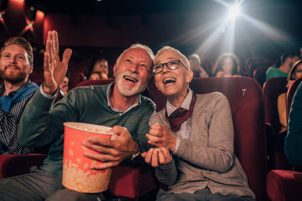 istock Smiling old people at cinema 1053060682