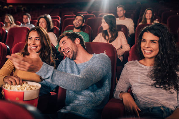 istock Smiling friends at cinema 1053062360