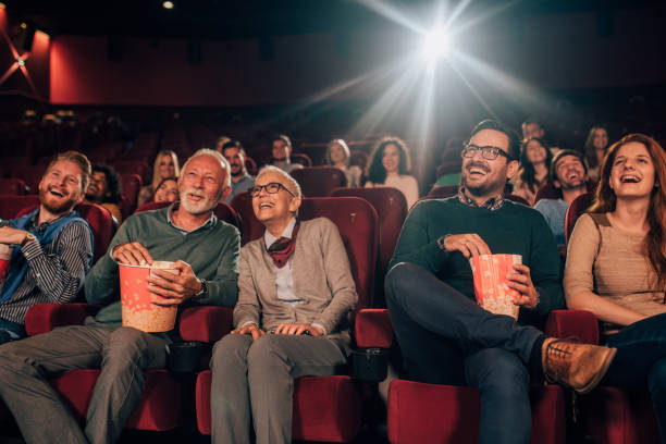 istock Young and old couple at cinema 1053062504