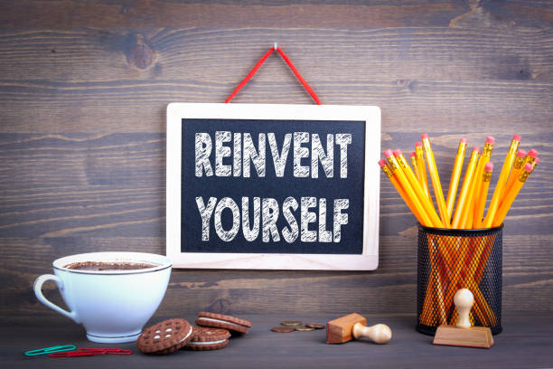 istock reinvent yourself. chalkboard on a wooden background 1053062596