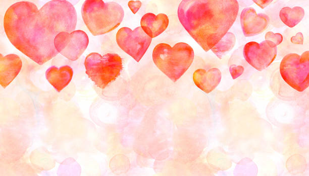 istock A border with hand drawn red watercolor hearts on a pink background, a greeting card design template with copy space 1053063450