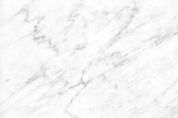 istock White Carrara Marble natural light surface for bathroom or kitchen countertop 1053064992