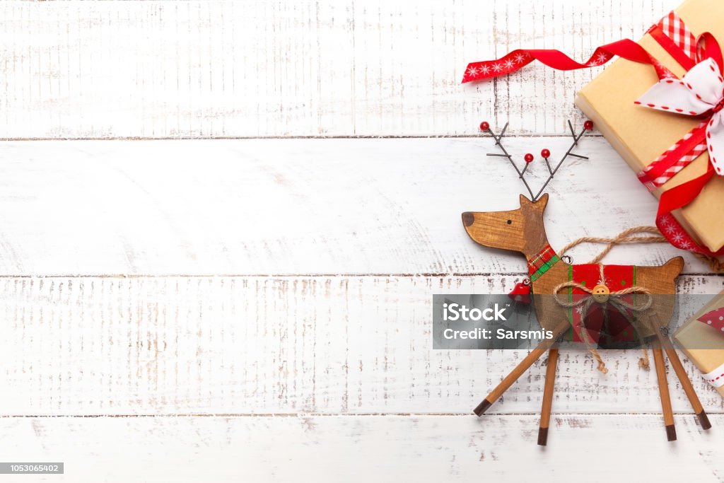 Christmas decoration. Christmas decoration and gift boxes on white wooden background. Christmas Stock Photo