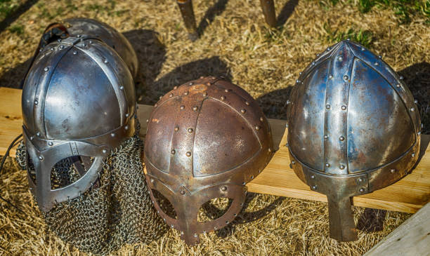 istock Three helmets with nose protection as worn by medieval knights in the Middle Ages 1053071010