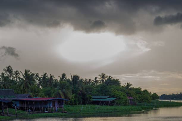 istock Overcast sky during sunset along Tha Chin river(Maenam Tha Chin),Nakhon Pathom,Thailand 1053071570