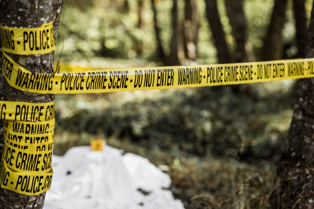 istock Cordon tape on crime scene 1053073522