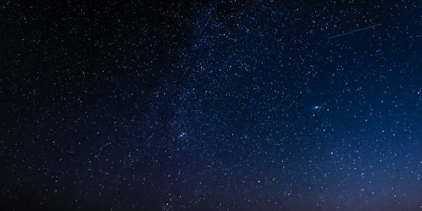 istock Night sky with stars and galaxy in outer space, universe background 1053075264