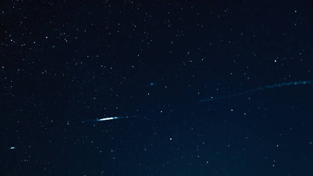 istock Night sky with stars and galaxy in outer space, universe background 1053075408