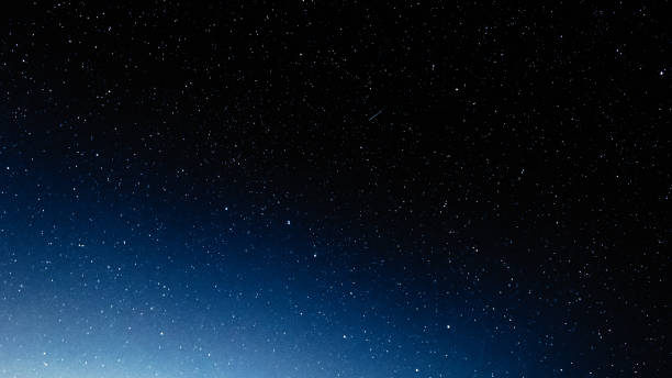 istock Night sky with stars and galaxy in outer space, universe background 1053075410