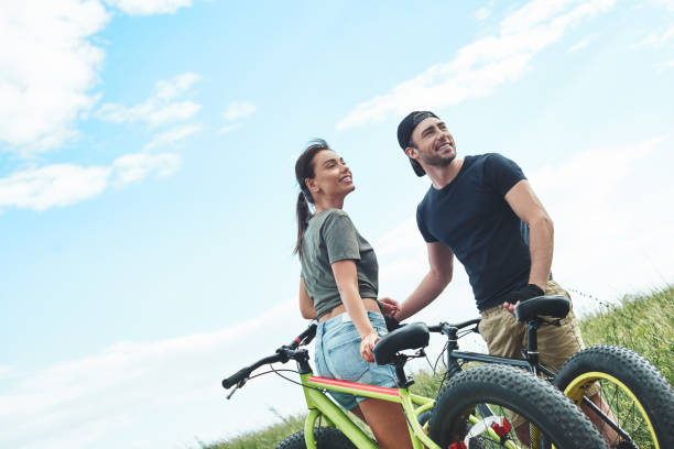 istock Romantic date on bikes, they like each other. Warm season 1053075482