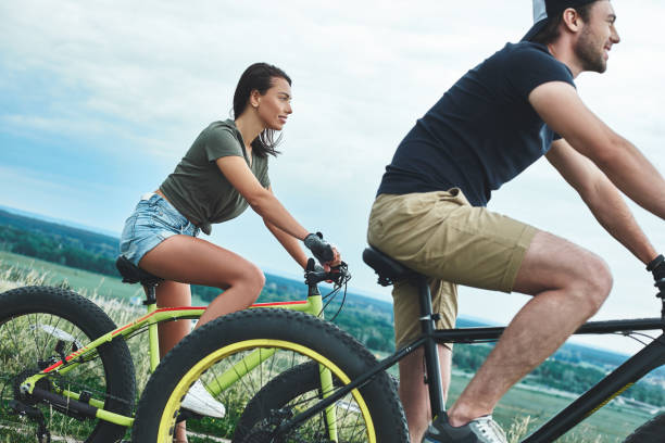 istock Couple riding bicycles one after another 1053075740