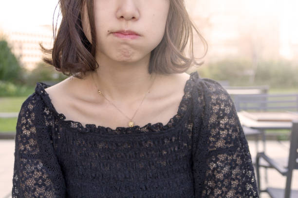Japanese teenage girl at a cafe, outside.