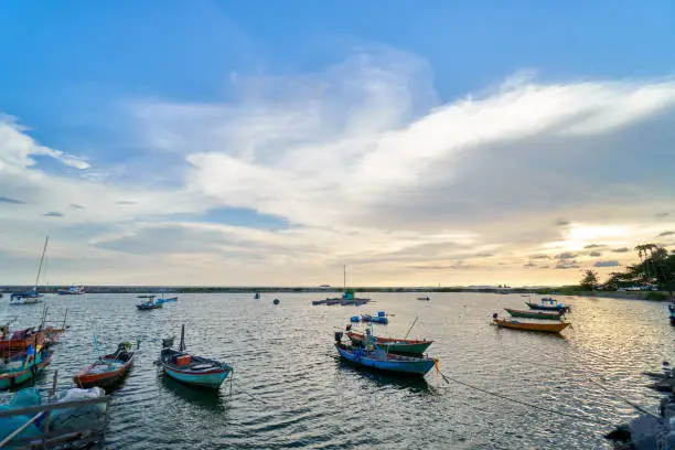 Landscape of view the fishing harbor Sunset Latinos There is a boat landing. In a fishing village in Rayong, Thailand, fishing is the main occupation of the people.
