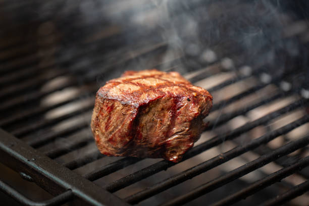 istock Beef Loin Top Sirloin Steak Cooking on the Grill 1053085196