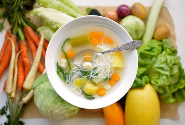 istock vegetable soup with rice cuttings 1053094086
