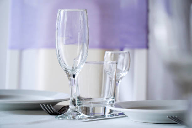 istock Empty plate, wine glasses, fork and knives on the table 1053098350