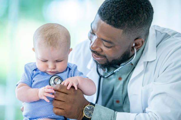 istock Doctor With Baby 1053098686