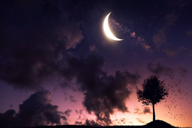 istock Bright moon in a beautiful colorful sunrise 1053101126