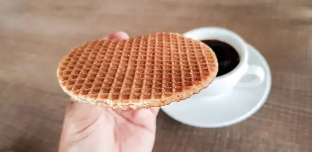 Photo of Stroopwafel a famous waffle from dutch. Eat it with black coffee.