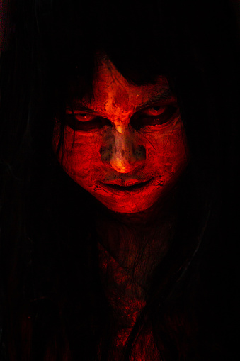 Portrait of angry red body women monster close up.  concept of halloween festival.